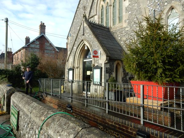 Ron Ives cleaning the paving at the United Reformed Church on 26th December 2017